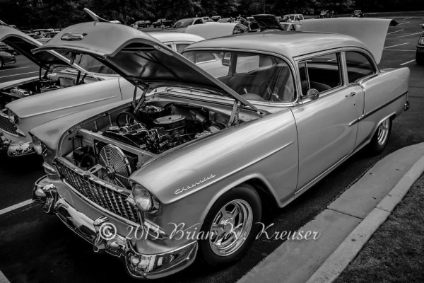black and white photo of a vintage 1955 chevy coupe