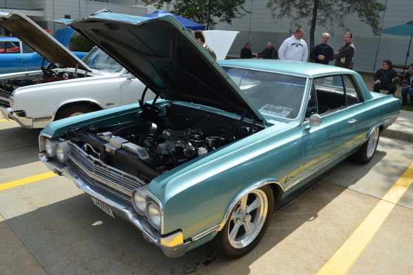 vintage oldsmobile cutlass coupe at a classic car show