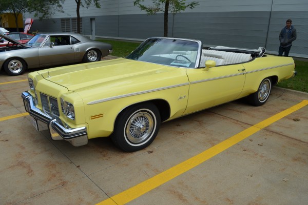 yellow oldsmobile delta 88 full size convertible coupe