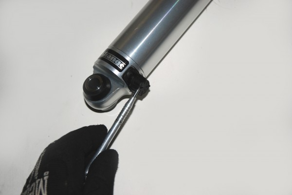 pointing to a shock adjustment knob