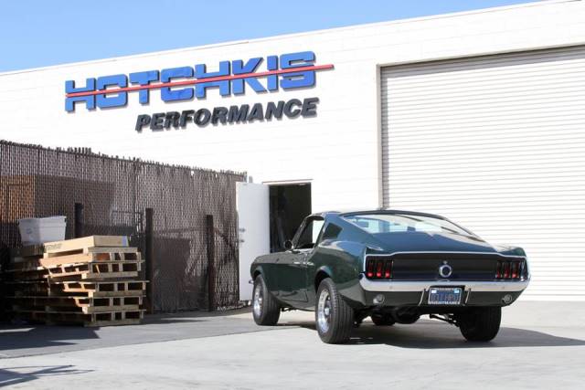 a vintage 1968 mustang parked at hotchkis factory