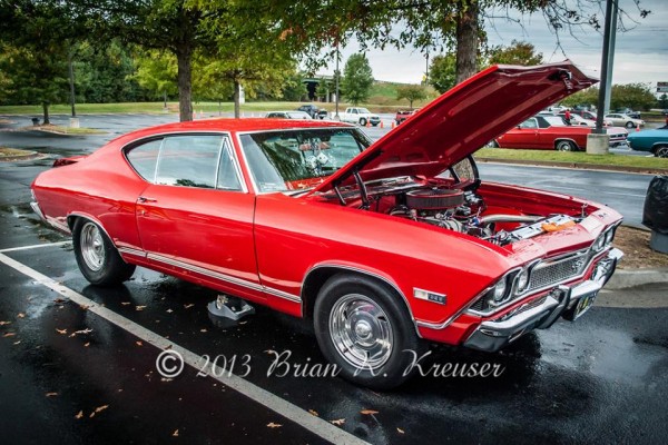 Vintage Red Chevelle SS fastback Coupe at car show