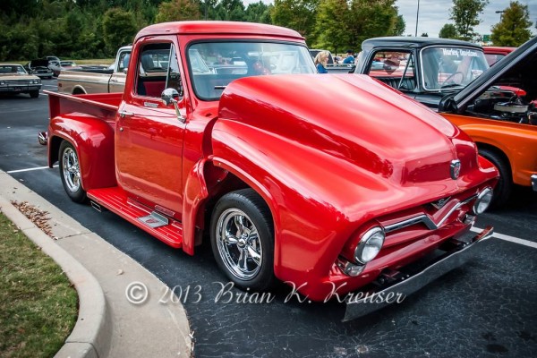 red ford hot rod truck with tilt front clip