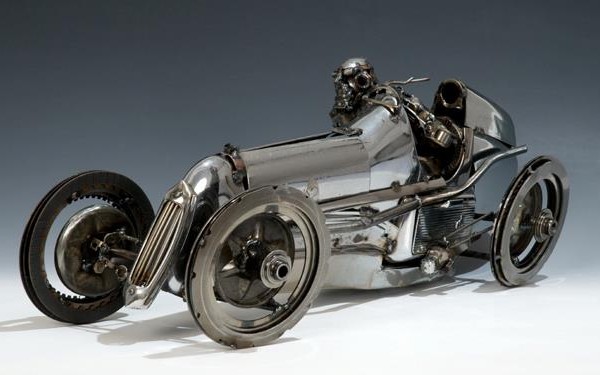vintage racecar and driver mechanical art sculpture