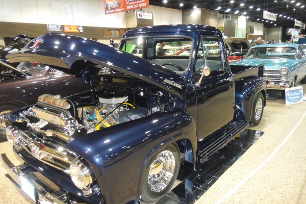 vintage custom blue pickup truck at a car show