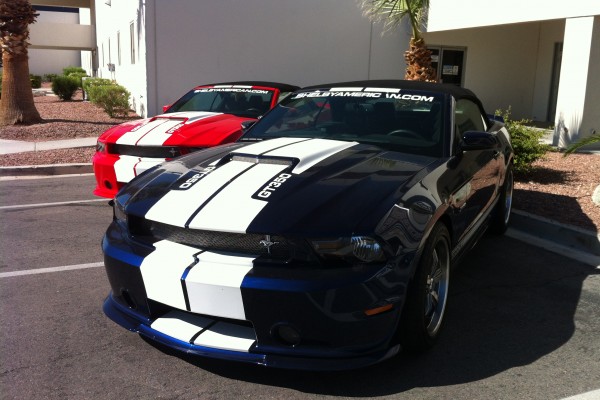 a pair of Shelby mustang GT350 coupes at Carrol Shelby museum