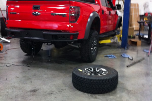 Ford f150 raptor on lift at Carrol Shelby factory