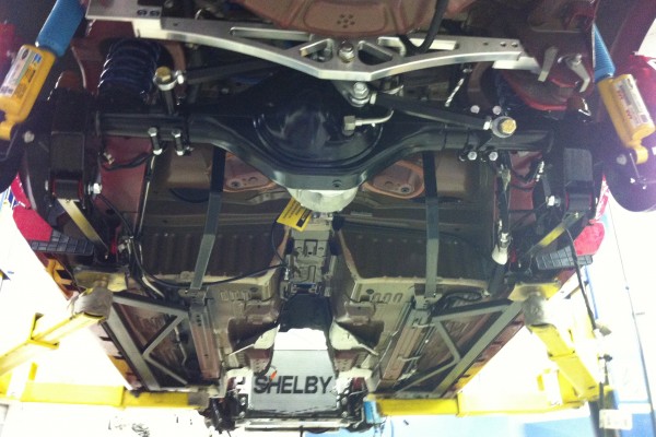 Chassis of a mustang on a lift at Carrol Shelby museum