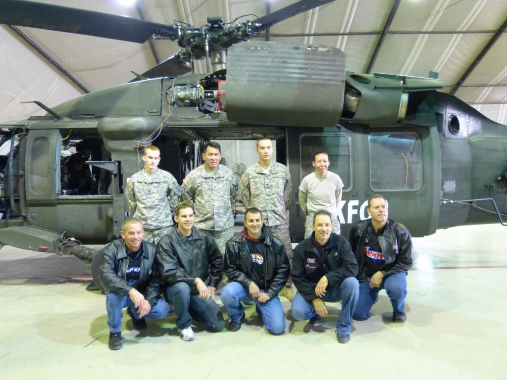 NHRA Race Drivers pose for photo with military troops stationed overseas