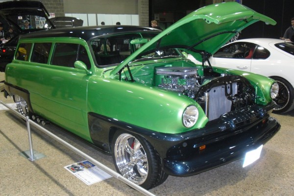 Custom green pontiac hot rod station wagon at a car show
