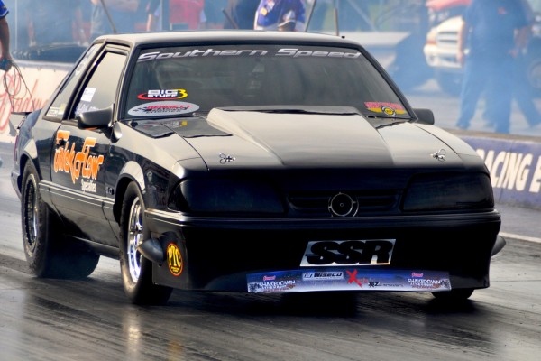 trick flow fox body ford mustang racing on dragstrip