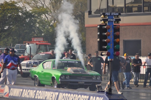 chevy chevelle drag car purging nitrous system prior to launch at a dragstrip