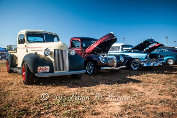 Row of classic cars and trucks at a cruise in show