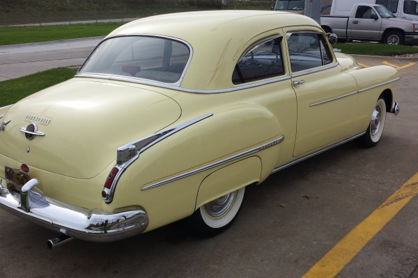 rear quarter bumper view of a 1950 Oldsmobile 88 coupe