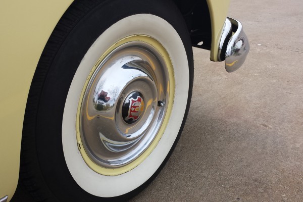 whitewall wheel and hubcap on a 1950 Oldsmobile 88 coupe