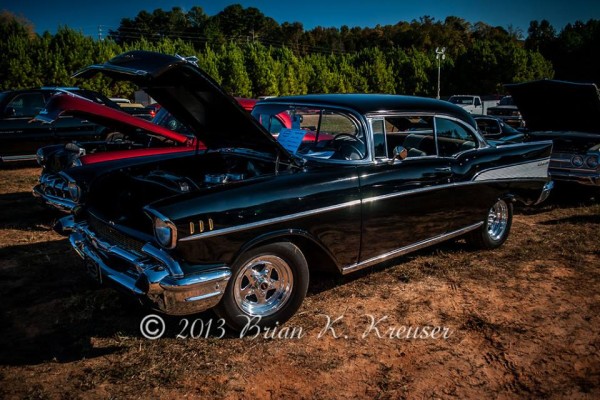 black 1957 chevy bel air hot rod coupe with weld wheels