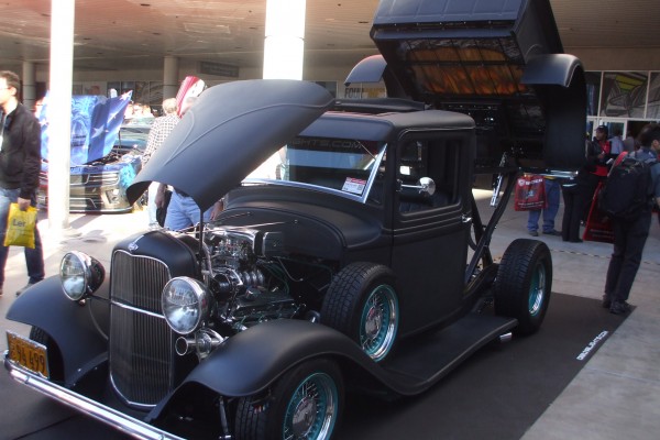 custom black ford hotrod pickup truck with hydraulic tilt bed