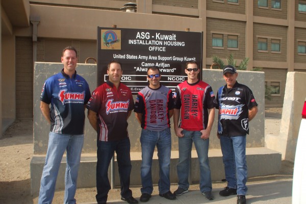 nhra drivers pose for a photo during overseas military base visit