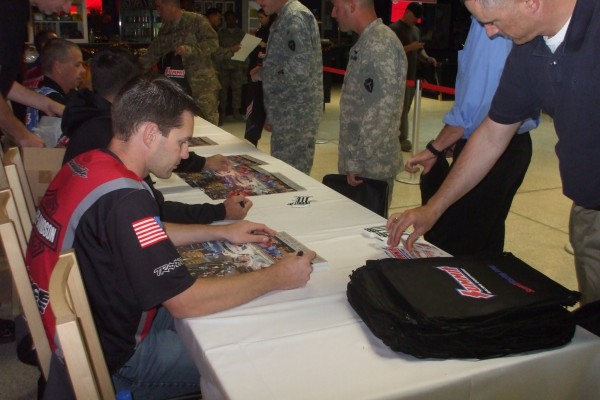 nhra drivers signing autographs during overseas military base visit