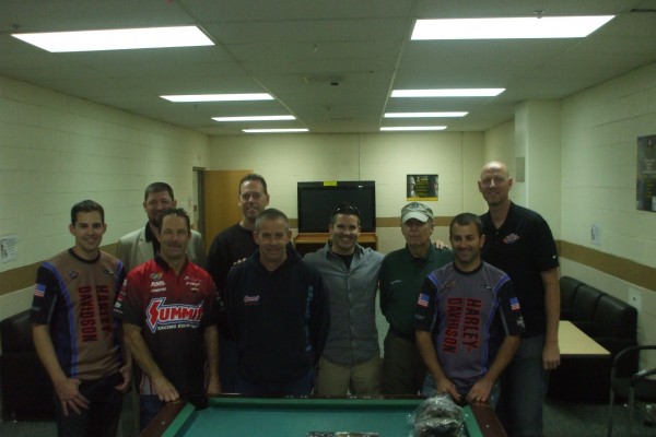 nhra drivers pose for a photo with military troops during overseas base visit