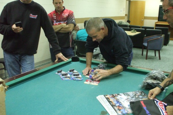 NHRA & Monster Truck Drivers signing autographs for troops stationed overseas