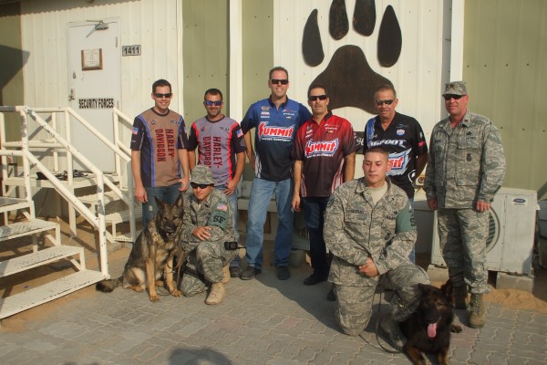 NHRA Drivers pose for a photo with military troops during overseas base visit