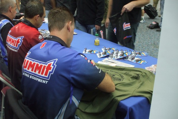 nhra drivers signing autographs for military troops stationed overseas