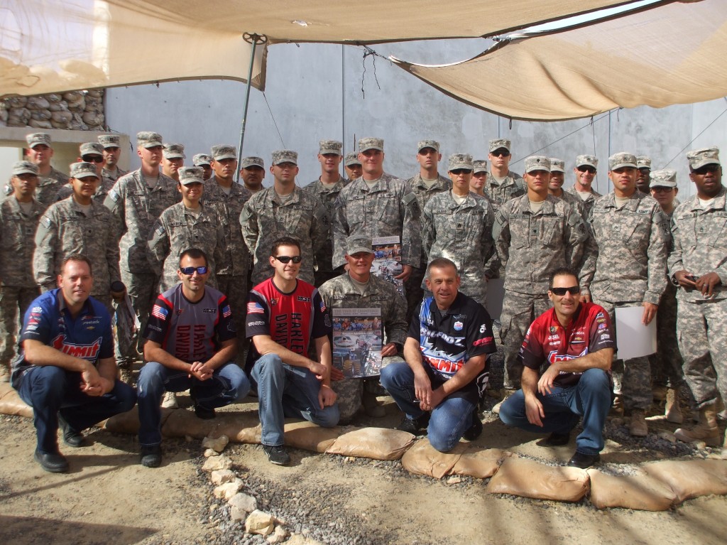 nhra and bigfoot drivers pose for photos with military troops stationed overseas
