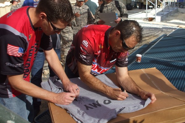 nhra drivers sign t shirts for military troops stationed overseas