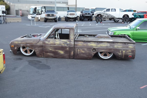 lowered custom sport truck with patina vinyl wrap