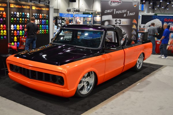 lowrider pickup truck with custom wheels and paint