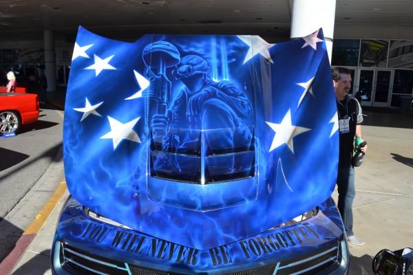 custom military themed mural on the hood of a car displayed at SEMA 2013