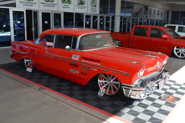 red customized 1956 chevy coupe displayed at SEMA 2013