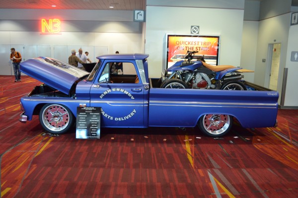 lowrider vintage truck with atv in bed displayed at SEMA 2013