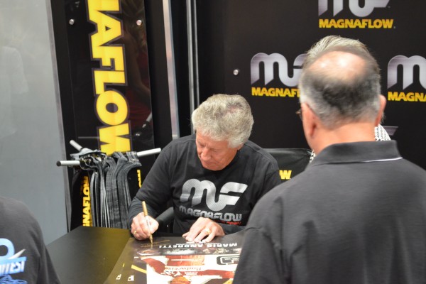 Mario Andretti signing autographs at SEMA 2013