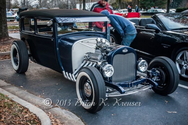 vintage blue ford tudor hot rod coupe with v8