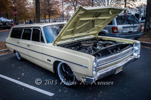 white ford station wagon with custom wheels