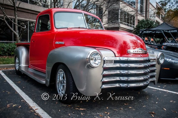 red and silver chevy 3100 hot rod pickup truck