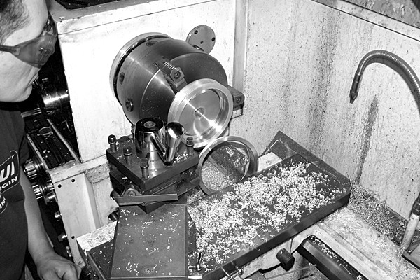 machining a crankshaft pulley on an industrial lathe