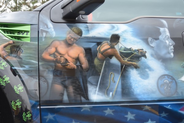 close up of Navy SEAL custom military paint scheme on a ford raptor truck