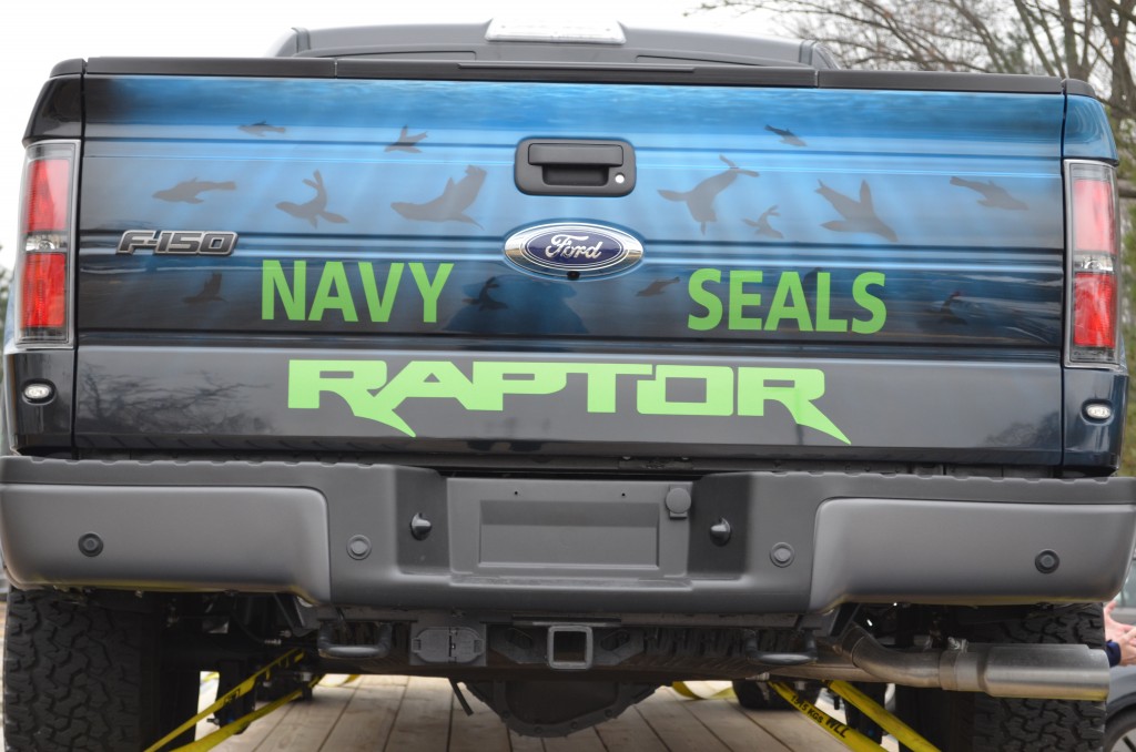close up of Navy SEAL custom military paint scheme on a ford raptor truck