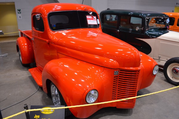Vintage hot rod truck on display at indoor car show