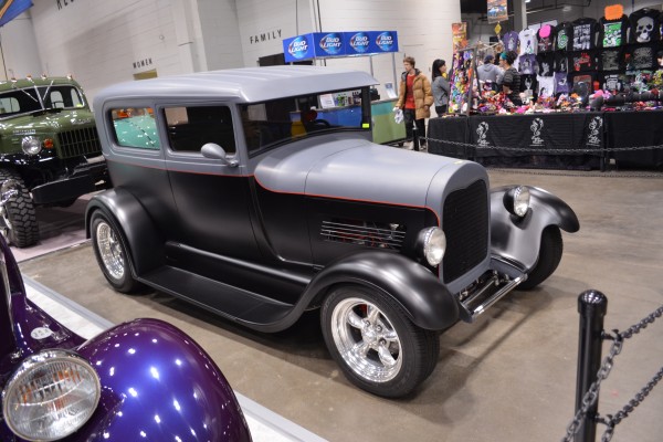 vintage ford tudor hot rod on display at indoor car show
