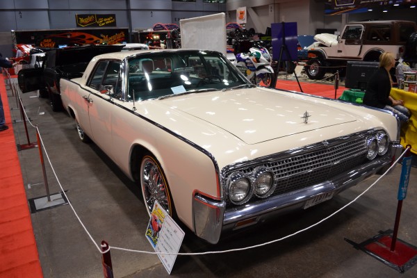 White lincoln continental with suicide doors At Indoor Car Show