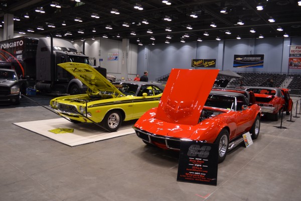 a 1968 Corvette and 1972 Dodge Challenger At Indoor Car Show
