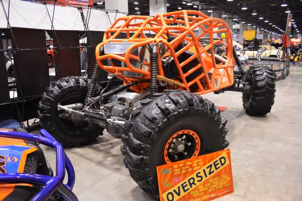customized rock crawler buggy at an indoor car show