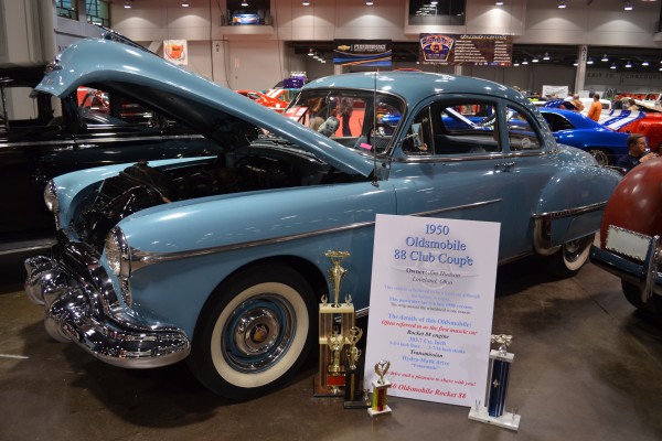1950 Oldsmobile 88 club coupe displayed at indoor car show