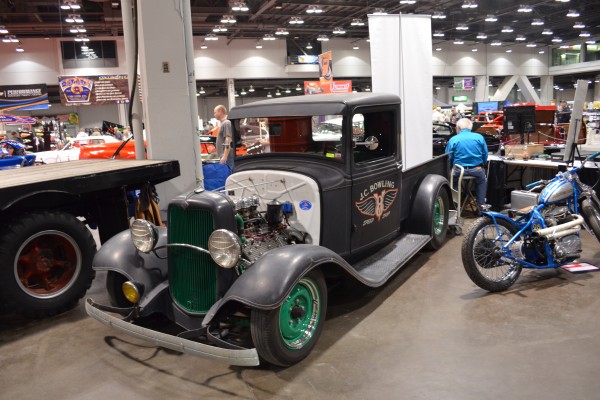 vintage prewar ford hotrod truck displayed at indoor car show