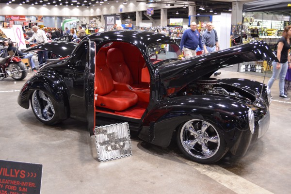 black custom willys hot rod coupe displayed at indoor car show