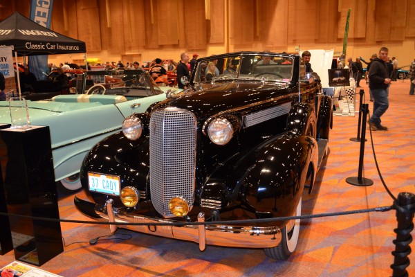 1937 Cadillac cabriolet on display at indoor car show